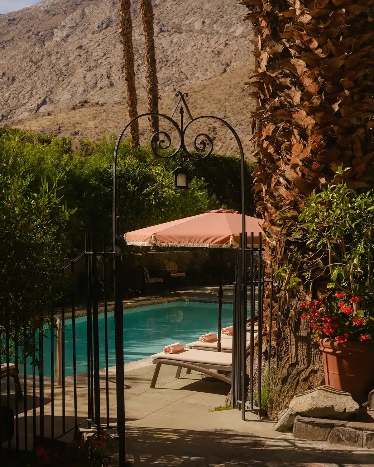 Exterior walkway and gate to pool overlooking hillside