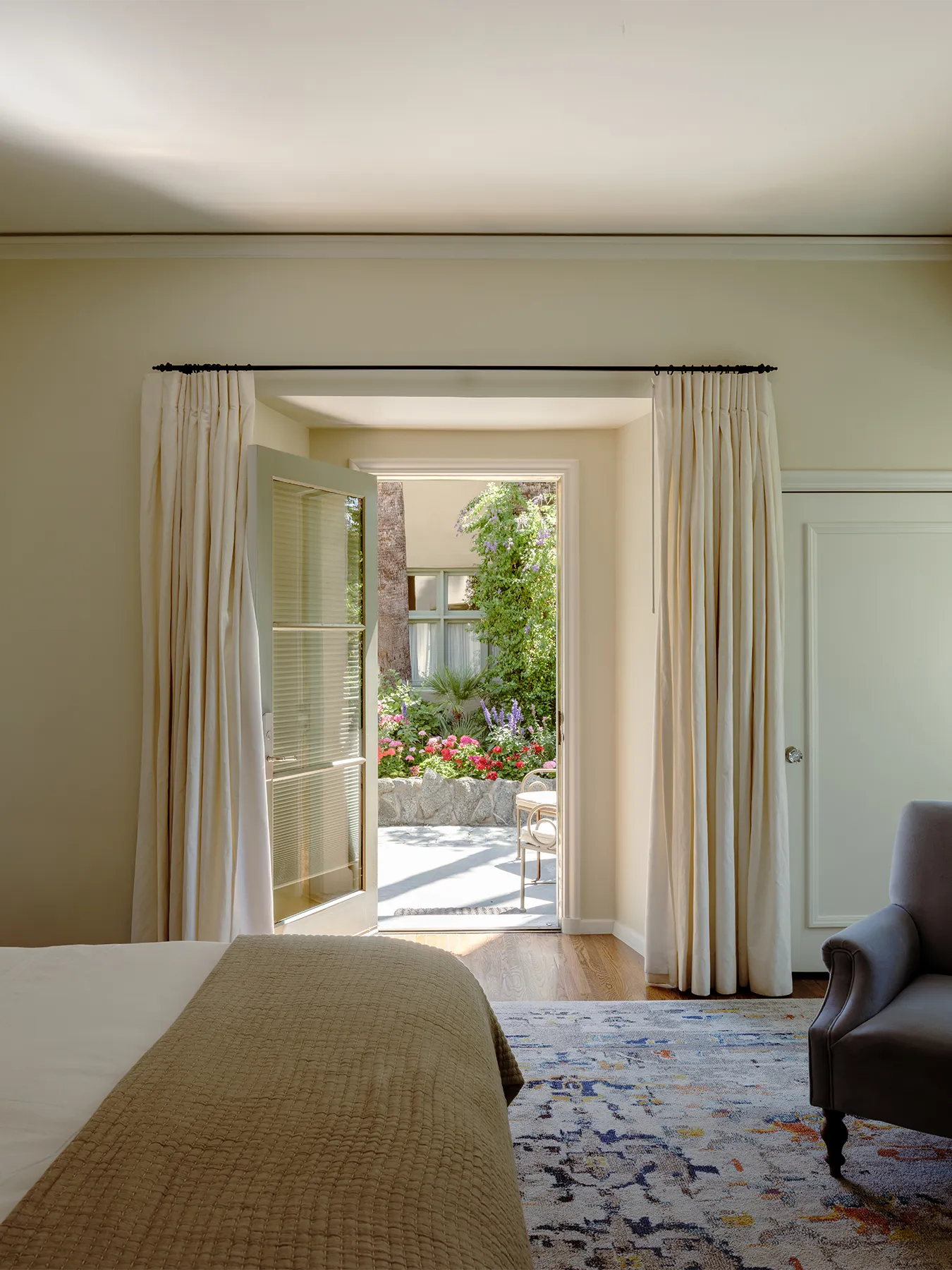 San Jancito room with bed and door open leading to patio