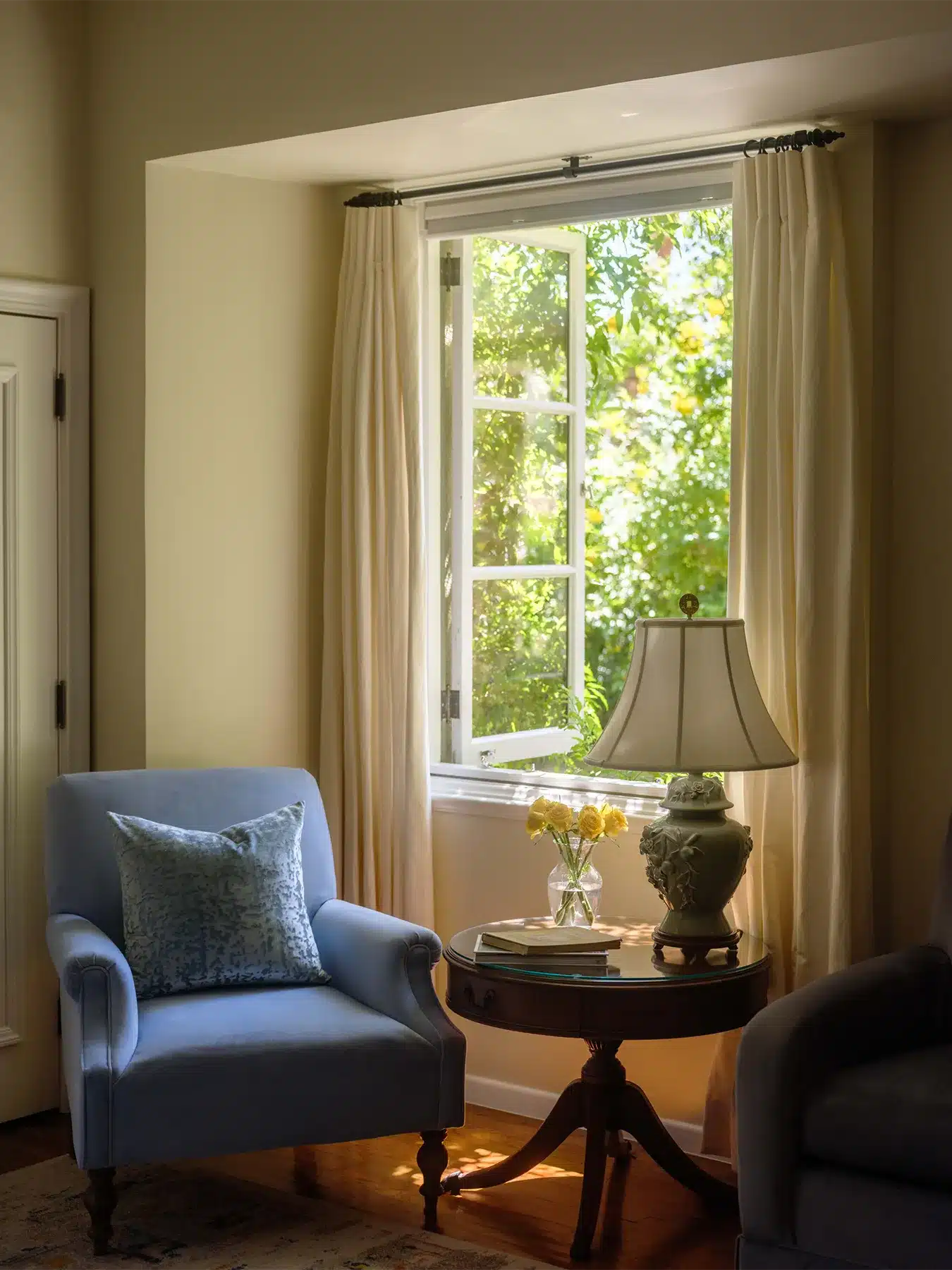 San Jancito sitting area with chair under open window